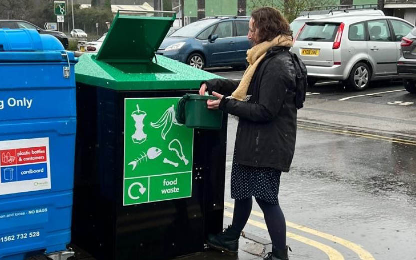 Storm Environmental - the full food solution - woman using the food waste bin